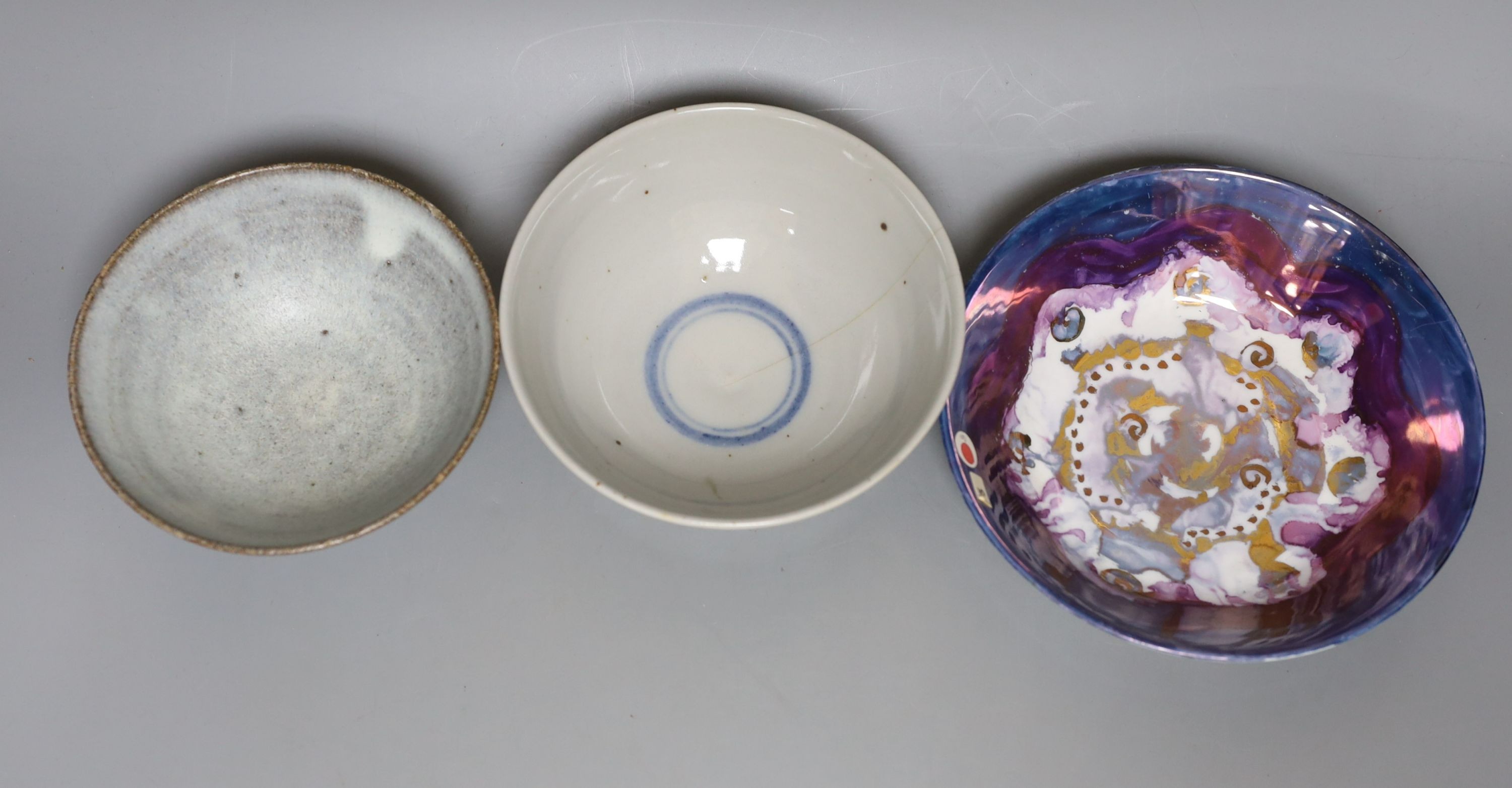 Two studio pottery bowls and a Chinese blue and white bowl, largest 18cm